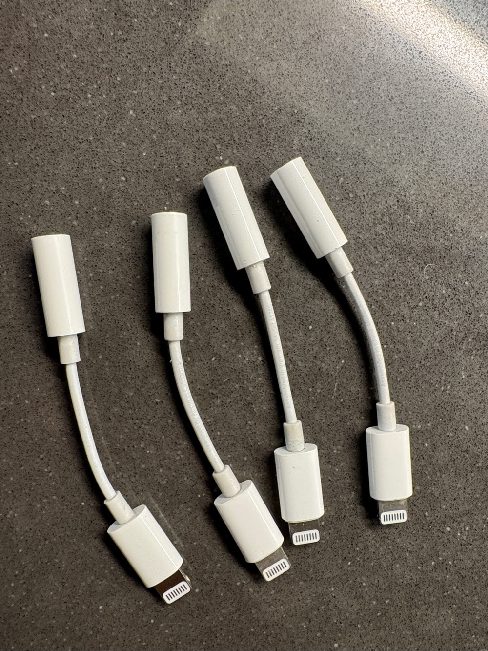 Apple Lightning to 3.5mm Audio Adapter Pack - White. Set of 4